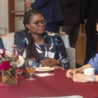 faculty sitting at table